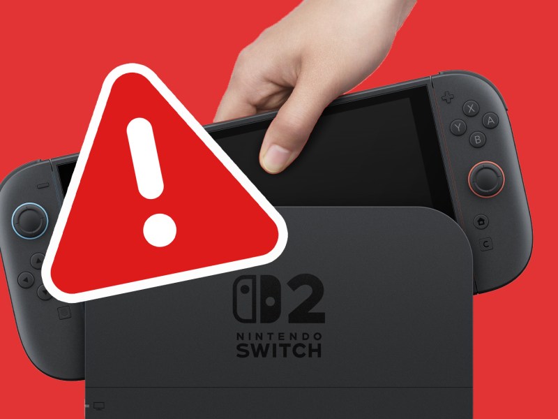 Eine Nintendo Switch 2 im Dock mit einem Warnzeichen